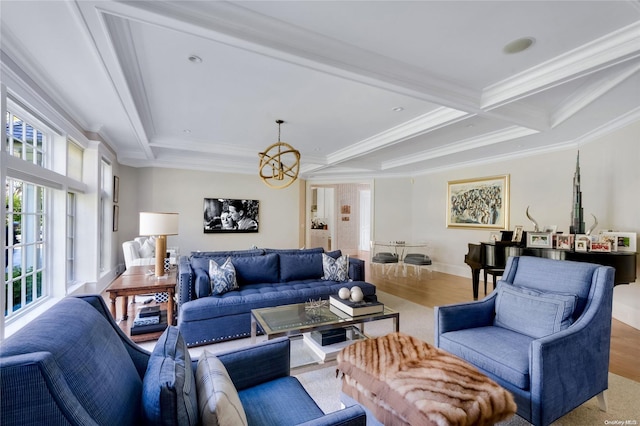 living room featuring hardwood / wood-style floors, coffered ceiling, an inviting chandelier, ornamental molding, and beamed ceiling