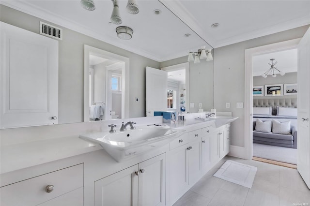 bathroom with vanity, tile patterned floors, and ornamental molding