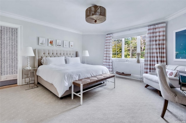 carpeted bedroom with ornamental molding