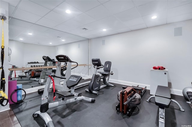 workout area featuring a paneled ceiling