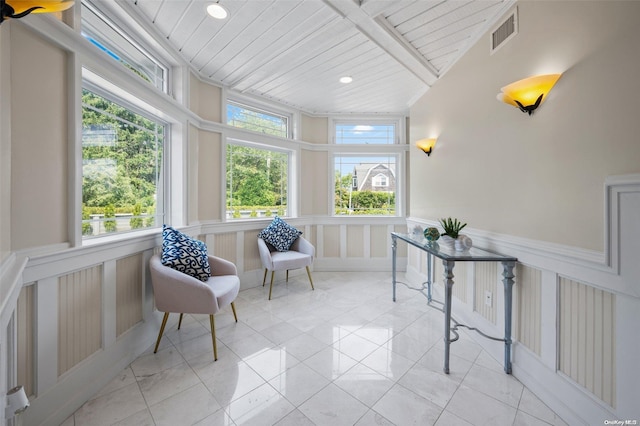 sunroom / solarium featuring wood ceiling