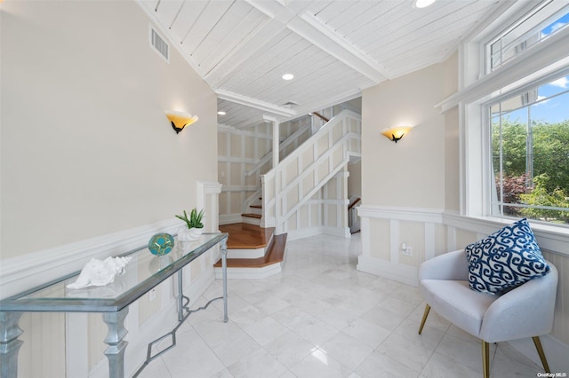 interior space with beamed ceiling and wooden ceiling