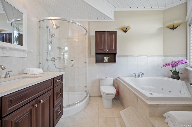 full bathroom featuring tile patterned flooring, vanity, toilet, and tile walls