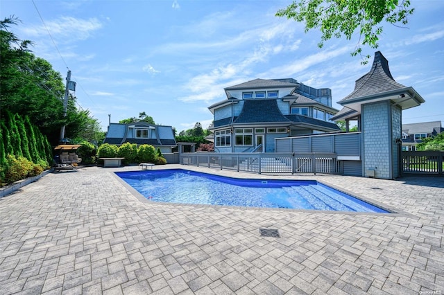 view of swimming pool featuring a patio area