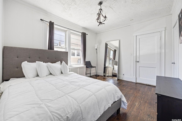 bedroom featuring crown molding, dark hardwood / wood-style floors, and a textured ceiling