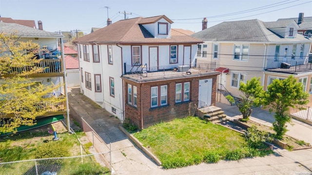 view of front of property with a balcony