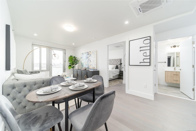 dining space featuring light hardwood / wood-style flooring