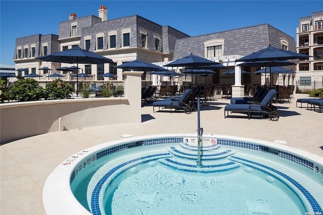 view of pool with a community hot tub