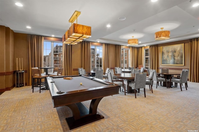 rec room featuring a raised ceiling, light carpet, and pool table