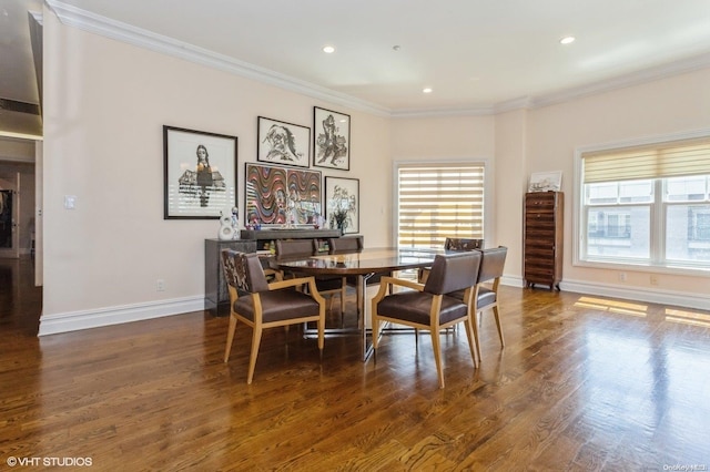 dining room with dark wood-type flooring and ornamental molding