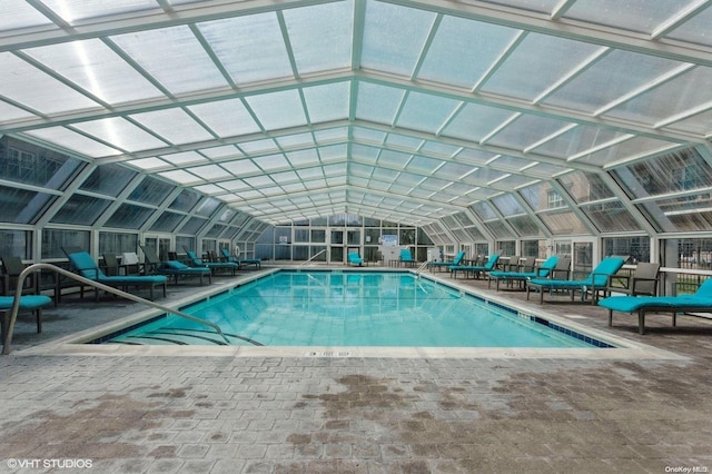 view of pool featuring a patio area and a lanai