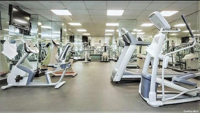 workout area with a drop ceiling