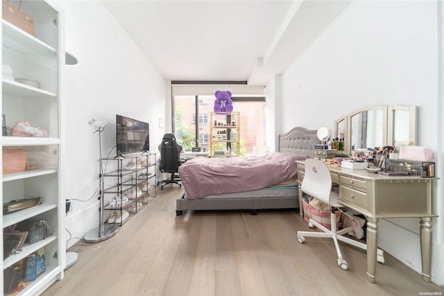 bedroom with light hardwood / wood-style flooring