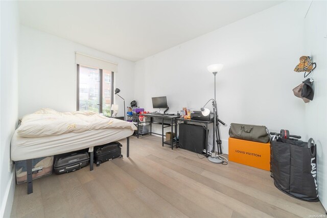 bedroom featuring light wood-type flooring