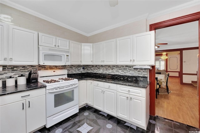 kitchen featuring white cabinets, dark wood-type flooring, white appliances, and ornamental molding