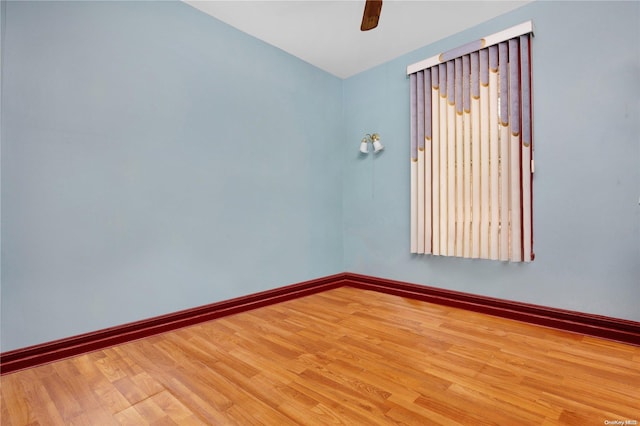 unfurnished room featuring hardwood / wood-style flooring and ceiling fan