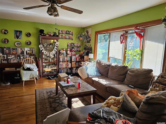 living room with ceiling fan and wood-type flooring