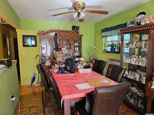 dining area featuring hardwood / wood-style flooring and ceiling fan