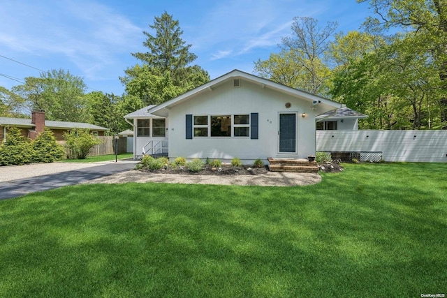 view of front of property with a front lawn