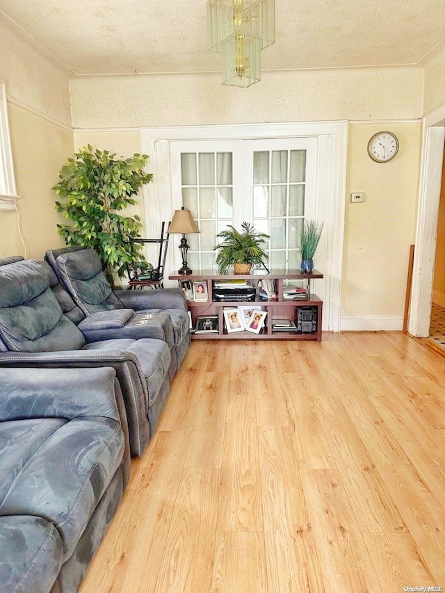 living room featuring a textured ceiling and hardwood / wood-style flooring