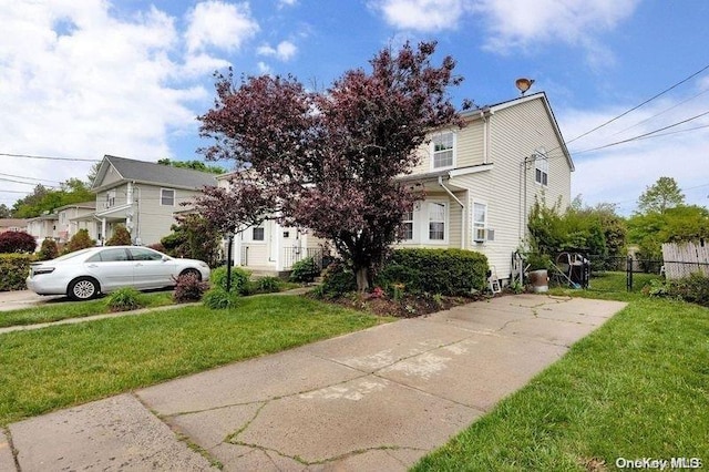 view of front of home featuring a front lawn