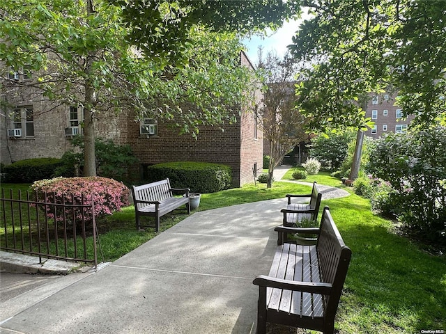 view of property's community featuring a lawn