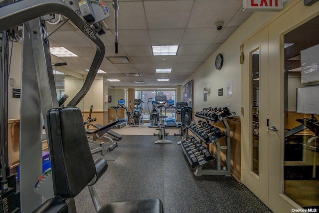 gym featuring a paneled ceiling