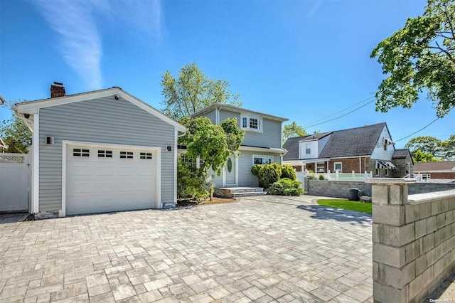 view of front of house featuring an outbuilding and a garage