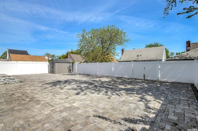 exterior space with a shed