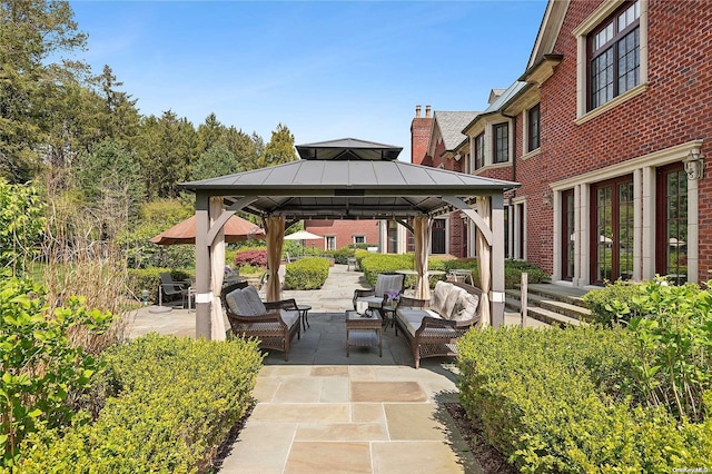 view of patio with a gazebo and an outdoor living space