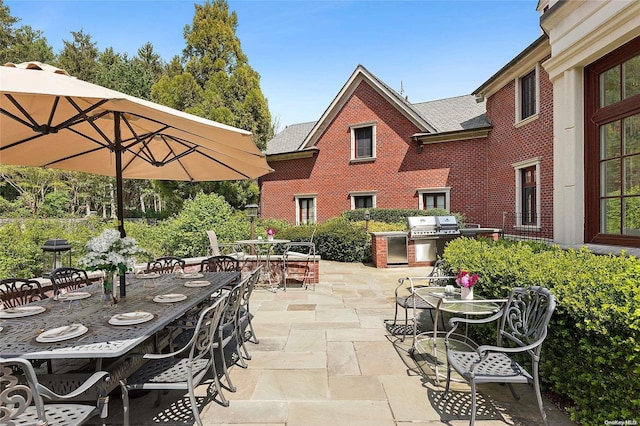 view of patio featuring a grill