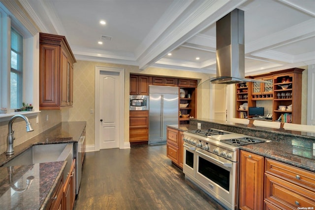 kitchen with dark hardwood / wood-style flooring, island range hood, crown molding, beam ceiling, and built in appliances