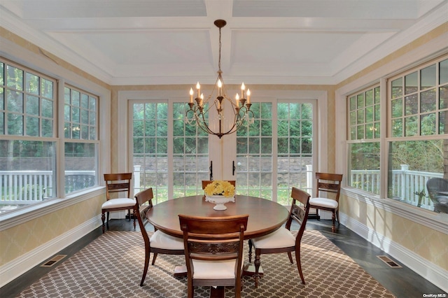 sunroom / solarium with beam ceiling, an inviting chandelier, a wealth of natural light, and coffered ceiling