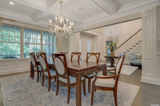 dining room featuring a chandelier, dark hardwood / wood-style flooring, ornamental molding, and coffered ceiling