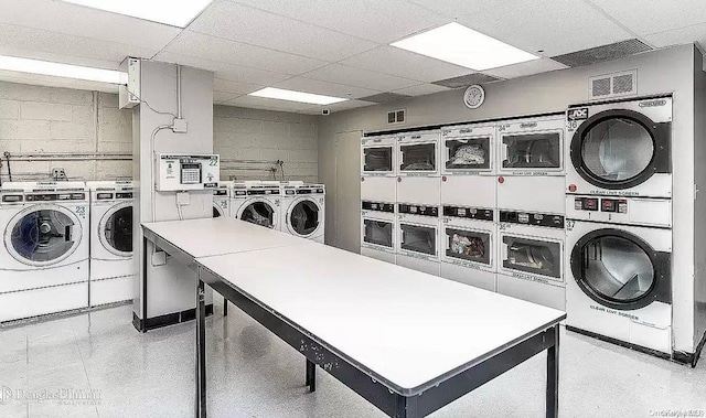 laundry area with washing machine and dryer and stacked washing maching and dryer