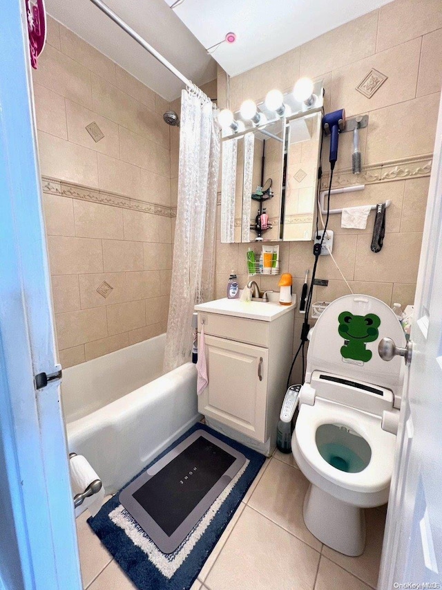 bathroom featuring vanity, tile patterned floors, tile walls, and shower / bath combo with shower curtain