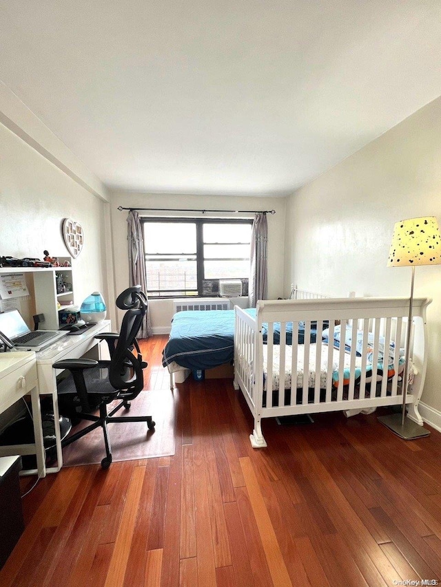 bedroom featuring hardwood / wood-style floors