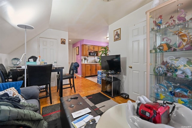 living room with light parquet flooring and lofted ceiling