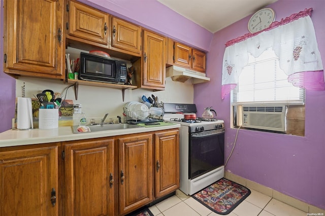 kitchen with cooling unit, light tile patterned floors, sink, and gas range gas stove