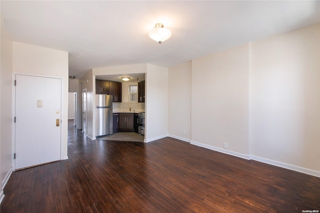 unfurnished living room featuring dark wood-type flooring