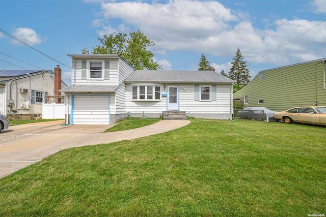 view of front of home featuring a front yard and a garage