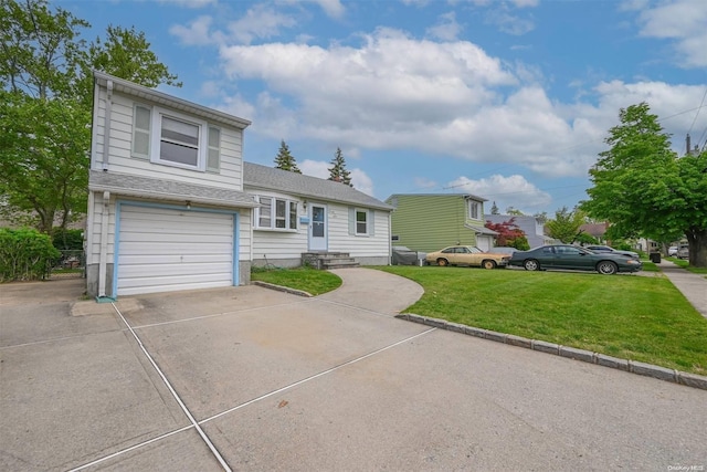 view of front of home with a garage and a front lawn