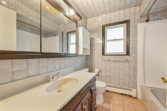 full bathroom with a baseboard radiator, tile patterned floors, toilet, vanity, and tile walls