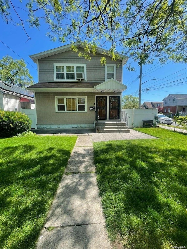 view of front of home featuring a front lawn