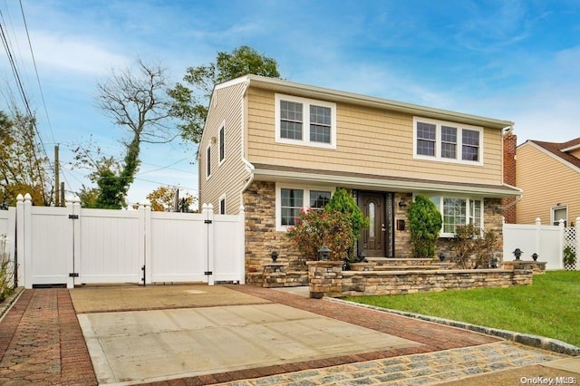 6 George Ave, Hicksville, NY 11801 - view of front of property featuring a gate, stone siding, and concrete driveway