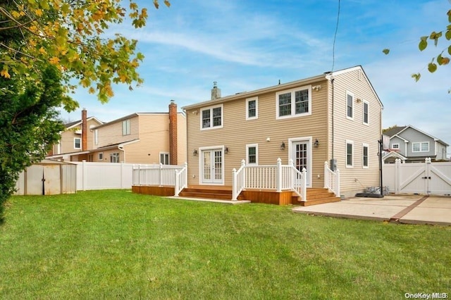 6 George Ave, Hicksville, NY 11801 - rear view of property featuring a gate, a fenced backyard, a deck, a patio area, and a chimney