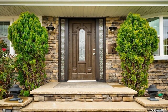 6 George Ave, Hicksville, NY 11801 - property entrance with a porch and stone siding