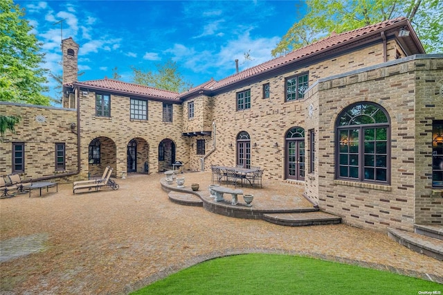 back of house with a patio area