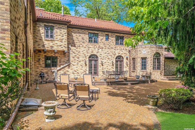 rear view of house with a patio