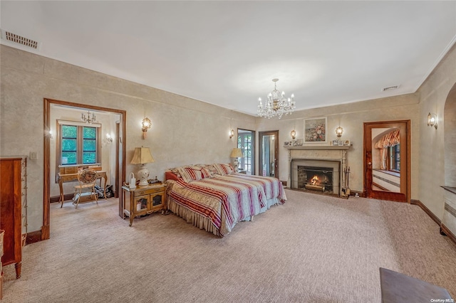 bedroom with a chandelier and carpet floors